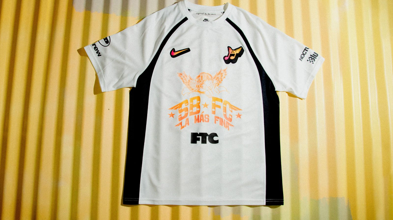 Nike SB Club 58 Skate Jersey from the SB FC Pack in white and black with the orange SB FC La Mas Fina angel graphic