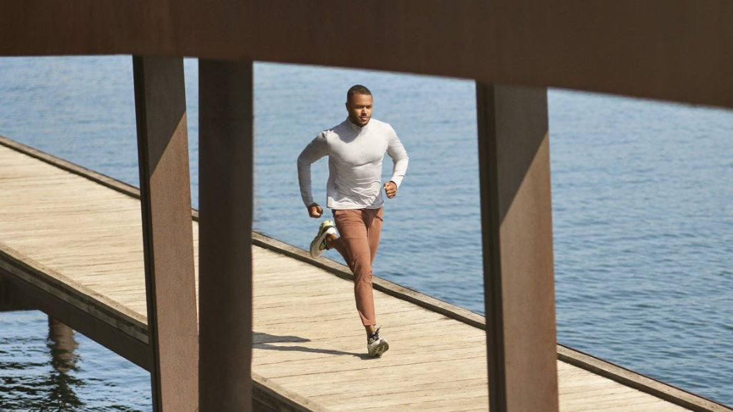 Runner in Vuori on a wooden pier over open water