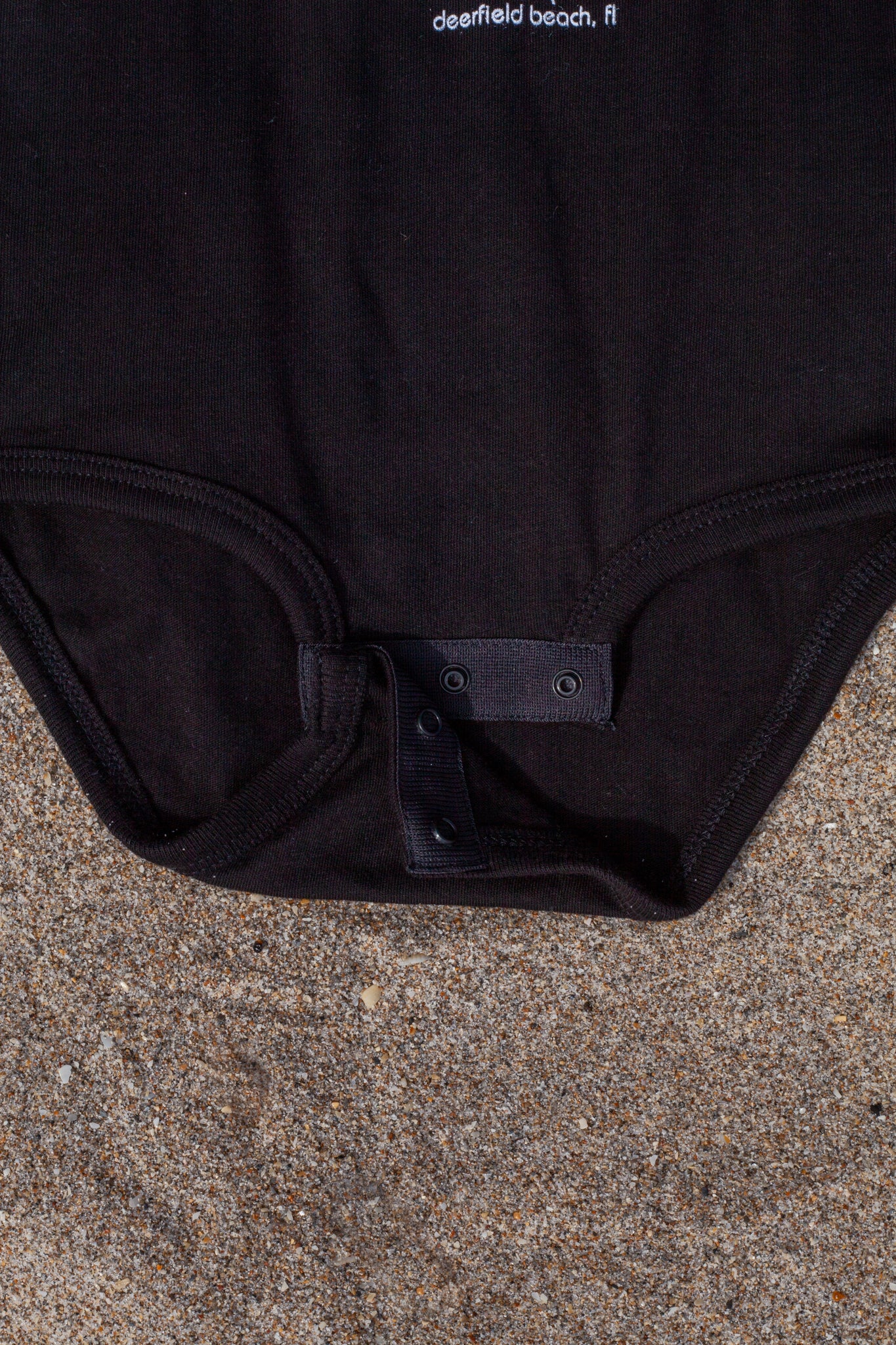 Island Water Sports Script DFB Baby Onesie Black-White 18M