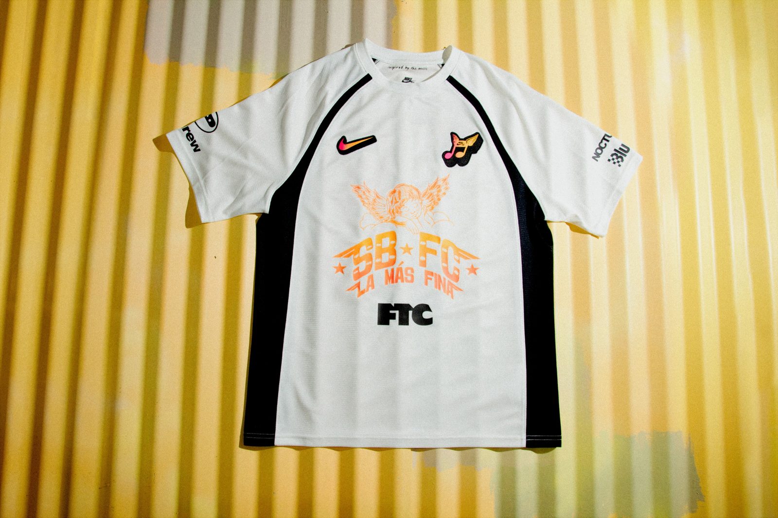 Nike SB Club 58 Skate Jersey from the SB FC Pack in white and black with the orange SB FC La Mas Fina angel graphic