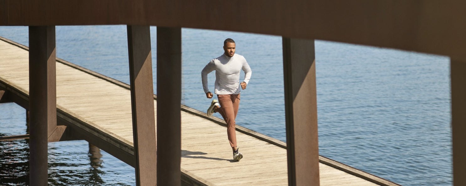 Runner in Vuori on a wooden pier over open water
