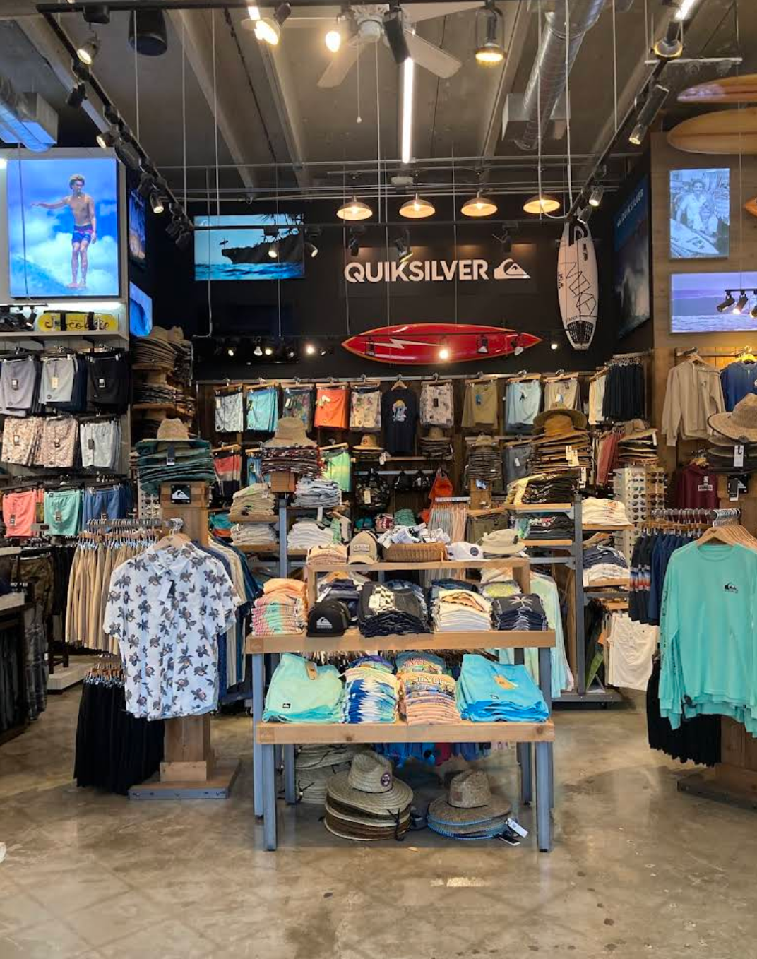 store interior with clothing and surfboard display