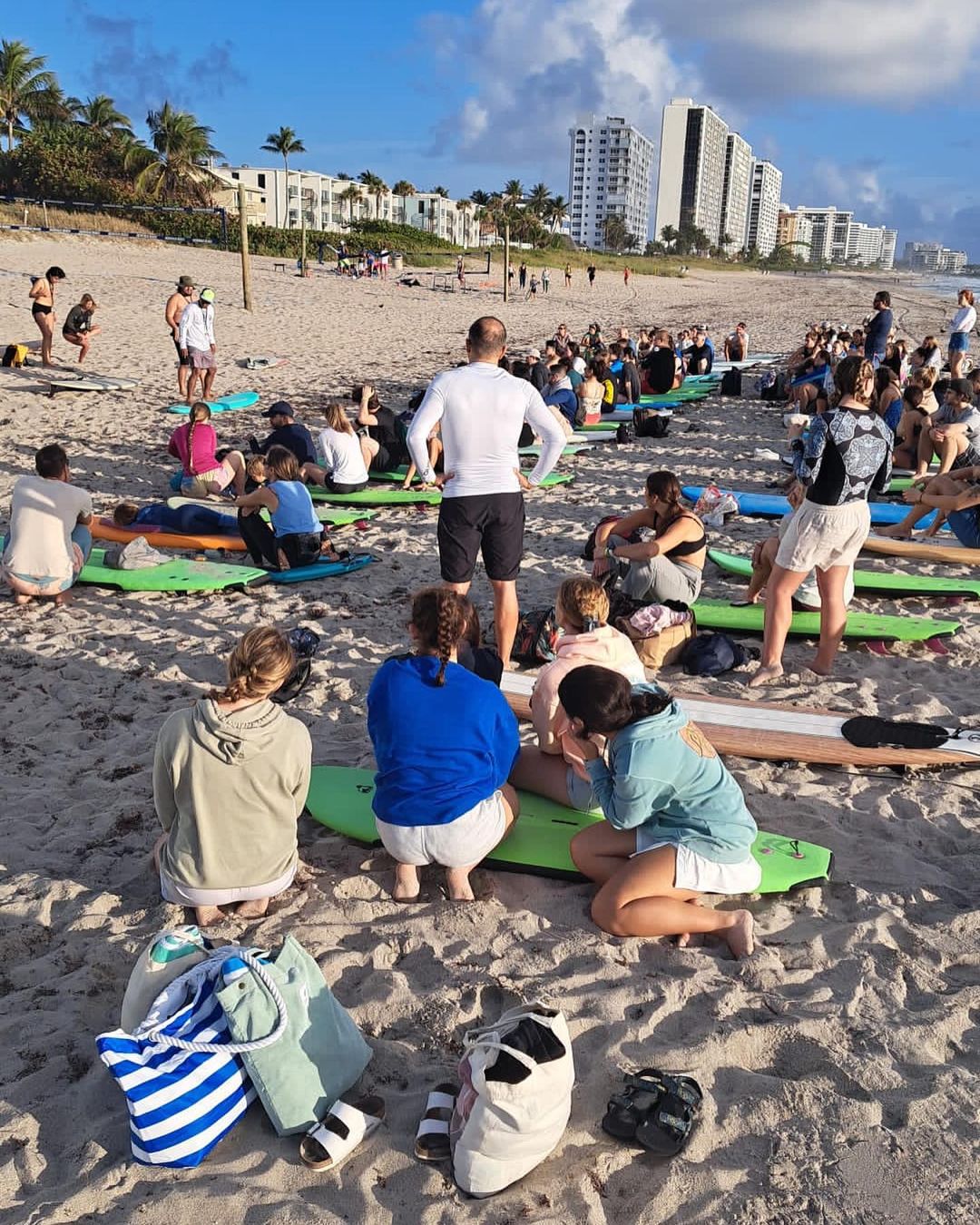 The free Saturday morning surf lesson crowd gathered on Deerfield Beach